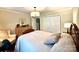 Comfortable bedroom with crown molding, dresser, soft lighting and closet at 3810 Biggers Rd, York, SC 29745