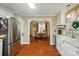 Kitchen view looking into dining room with stainless steel appliances and wood floors at 3810 Biggers Rd, York, SC 29745