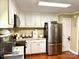 Kitchen with stainless steel appliances, bright lighting, and white cabinetry at 3810 Biggers Rd, York, SC 29745