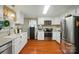 Functional kitchen with white cabinets, stainless steel appliances, and plenty of counter space for meal preparation at 3810 Biggers Rd, York, SC 29745