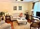 Bright and airy living room featuring neutral furnishings, hardwood floors, and ample lighting at 3810 Biggers Rd, York, SC 29745