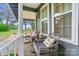 Cozy front porch adorned with rocking chairs and decorative pillows provides a welcoming outdoor seating area at 3810 Biggers Rd, York, SC 29745