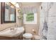 Cozy bathroom featuring neutral walls, floating shelves, and charming Paris themed shower curtain at 39 Selma Dr, Mooresville, NC 28115