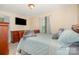 Comfortable bedroom with wood furniture, neutral walls, and decorative window treatments at 39 Selma Dr, Mooresville, NC 28115