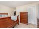 Bedroom featuring wood furniture, a plush bed, and carpeted floors at 39 Selma Dr, Mooresville, NC 28115