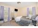 Bedroom with neutral walls, carpet flooring, tv, mirror and comfortable bed at 39 Selma Dr, Mooresville, NC 28115