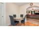Cozy dining area featuring a round table with glass top and decorative base with seating for four at 39 Selma Dr, Mooresville, NC 28115