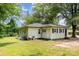 Quaint single-story home with green lawn and inviting front porch at 39 Selma Dr, Mooresville, NC 28115