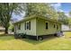 Green house with siding, black trim, and a large yard at 39 Selma Dr, Mooresville, NC 28115