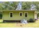 Side view of light green house with three windows and lawn at 39 Selma Dr, Mooresville, NC 28115