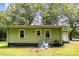 Side view of light green house with three windows and lawn at 39 Selma Dr, Mooresville, NC 28115
