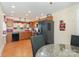 Spacious eat-in kitchen with modern appliances, wood cabinets, and decorative wall art at 39 Selma Dr, Mooresville, NC 28115