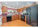 Bright kitchen with updated appliances, ample counter space, and decorative window treatments at 39 Selma Dr, Mooresville, NC 28115