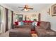 Warm living room with a plush brown sectional sofa and soft, natural lighting at 39 Selma Dr, Mooresville, NC 28115