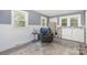Inviting living room with included washer and dryer, comfortable seating, and ample natural light at 39 Selma Dr, Mooresville, NC 28115