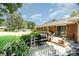 Charming backyard deck featuring a grill, seating area, and lush landscaping at 400 S Westover Dr, Monroe, NC 28112