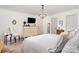 Bright bedroom features a beaded chandelier, modern dresser, and neutral walls at 400 S Westover Dr, Monroe, NC 28112