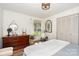 Light-filled bedroom featuring modern ceiling fan, wood floors, and natural light at 400 S Westover Dr, Monroe, NC 28112