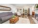 Cozy living room featuring hardwood floors, a decorative fireplace, and natural lighting at 400 S Westover Dr, Monroe, NC 28112