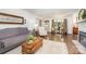 Cozy living room featuring hardwood floors, a decorative fireplace, and natural lighting at 400 S Westover Dr, Monroe, NC 28112