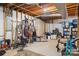 Unfinished basement featuring exposed beams, home gym equipment, and storage space at 4026 Biggerstaff Rd, Maiden, NC 28650