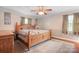 Traditional bedroom with wooden furniture and neutral decor at 4026 Biggerstaff Rd, Maiden, NC 28650