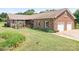 Charming brick home featuring an attached two car garage and a well-maintained front lawn at 4026 Biggerstaff Rd, Maiden, NC 28650