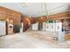 Spacious garage with wood paneling and ample storage, providing plenty of room for vehicles and projects at 4026 Biggerstaff Rd, Maiden, NC 28650