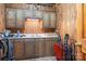 Functional kitchenette with wooden cabinetry and ample counter space, perfect for additional cooking needs at 4026 Biggerstaff Rd, Maiden, NC 28650