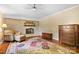 Living room with brick fireplace, seating, and a decorative rug at 4026 Biggerstaff Rd, Maiden, NC 28650