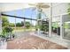 Bright sunroom with tile floors, green plants, lots of natural light and large windows with outside view at 4026 Biggerstaff Rd, Maiden, NC 28650