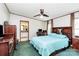 Inviting bedroom featuring a ceiling fan, comfortable queen bed, a vanity area, and an ensuite bathroom at 4104 Pebblebrook Sw Cir, Concord, NC 28027