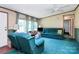 Comfortable living room featuring plush seating, large windows for natural light, and neutral decor, offering a relaxing space at 4104 Pebblebrook Sw Cir, Concord, NC 28027