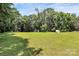 Expansive green lawn perfect for recreation and enjoying the beauty of nature at 4104 Pebblebrook Sw Cir, Concord, NC 28027