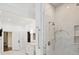 Bathroom featuring a glass-enclosed shower, marble tile, and modern fixtures at 4300 Cameron Oaks Dr, Charlotte, NC 28211