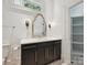 Bathroom with dark cabinets, countertop, and large mirror at 4300 Cameron Oaks Dr, Charlotte, NC 28211