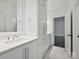 Modern bathroom with white cabinets, marble floors, and sleek countertop at 4300 Cameron Oaks Dr, Charlotte, NC 28211