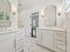 Dual vanity bathroom featuring marble floors, a large mirror, and modern fixtures at 4300 Cameron Oaks Dr, Charlotte, NC 28211