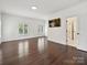 Bright bedroom with hardwood floors, large windows, and fresh white trim at 4300 Cameron Oaks Dr, Charlotte, NC 28211