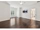 Bright bedroom with hardwood floors and a ceiling fan, illuminated by natural light at 4300 Cameron Oaks Dr, Charlotte, NC 28211