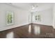 Light-filled bedroom with rich hardwood floors and views of the exterior at 4300 Cameron Oaks Dr, Charlotte, NC 28211