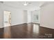 Spacious bedroom with hardwood floors, fresh white trim, and a ceiling fan at 4300 Cameron Oaks Dr, Charlotte, NC 28211
