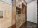 Spacious closet with custom wood organizers and shelving system, offering ample storage at 4300 Cameron Oaks Dr, Charlotte, NC 28211