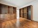 Walk-in closet with wood cabinetry, multiple shelves, drawers, and ample storage solutions at 4300 Cameron Oaks Dr, Charlotte, NC 28211