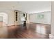 Spacious living room with custom built-in shelving, hardwood floors, and natural light at 4300 Cameron Oaks Dr, Charlotte, NC 28211