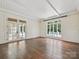 Bright living room with hardwood floors, shiplap walls, and a view of the pool at 4300 Cameron Oaks Dr, Charlotte, NC 28211