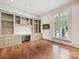 Office space with custom built-in shelving, plantation shutters, and hardwood floors at 4300 Cameron Oaks Dr, Charlotte, NC 28211