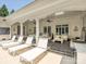Relaxing outdoor patio with white lounge chairs, perfect for enjoying sunny days by the pool at 4300 Cameron Oaks Dr, Charlotte, NC 28211