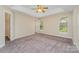 Spacious bedroom with large windows offering plenty of natural light, and a ceiling fan at 5322 Jocelyn Ln, Charlotte, NC 28269