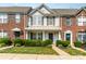 Charming townhome with a manicured lawn and classic architectural details, showcasing a welcoming entrance at 5322 Jocelyn Ln, Charlotte, NC 28269